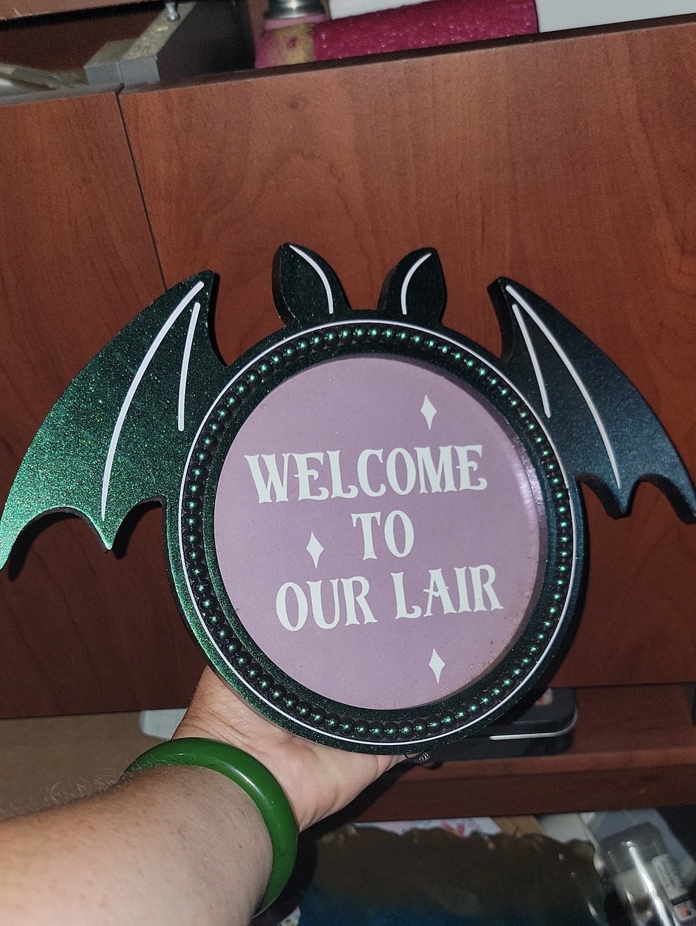 Welcome To Our Lair Bat Wall Sign - Black & Iridescent Green